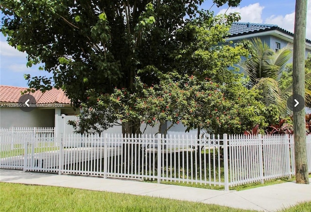 view of property hidden behind natural elements