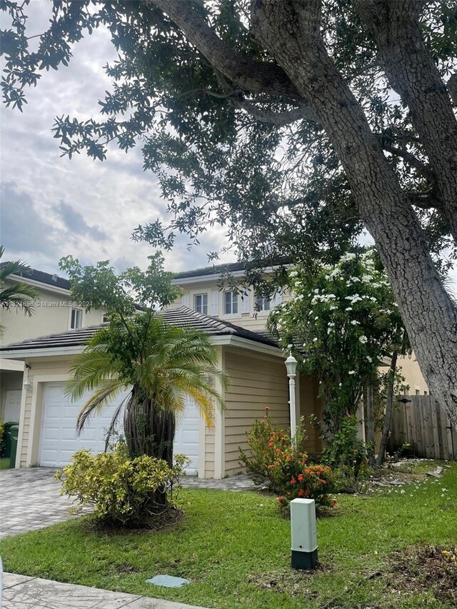 view of side of property with a garage