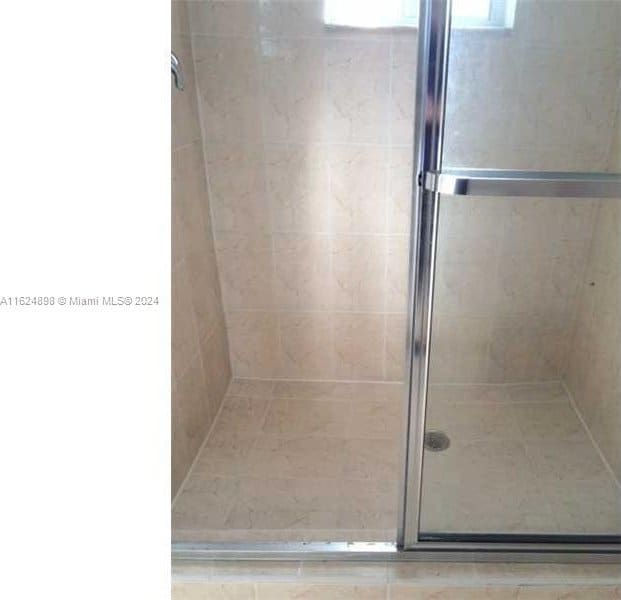 bathroom featuring walk in shower