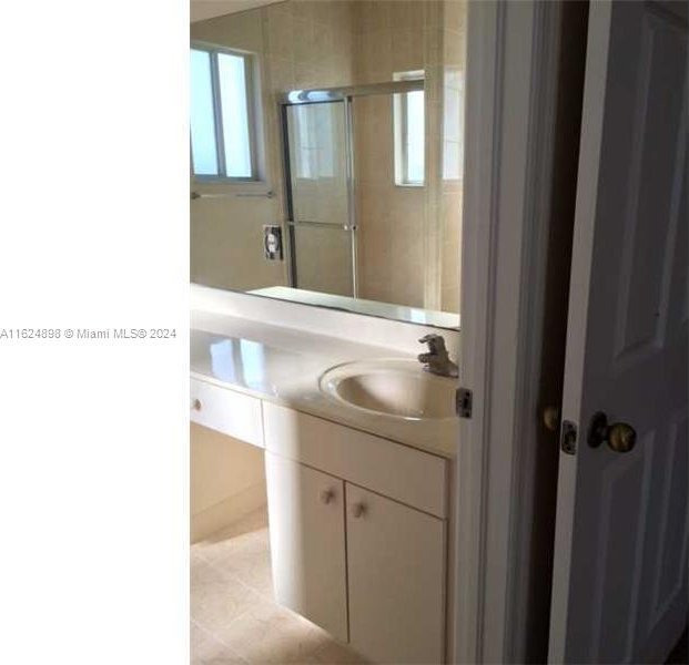 bathroom featuring vanity and tile patterned flooring