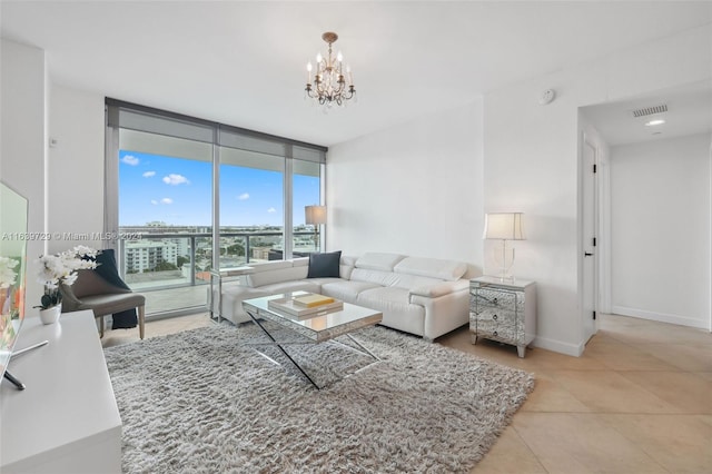 tiled living room with floor to ceiling windows and a notable chandelier