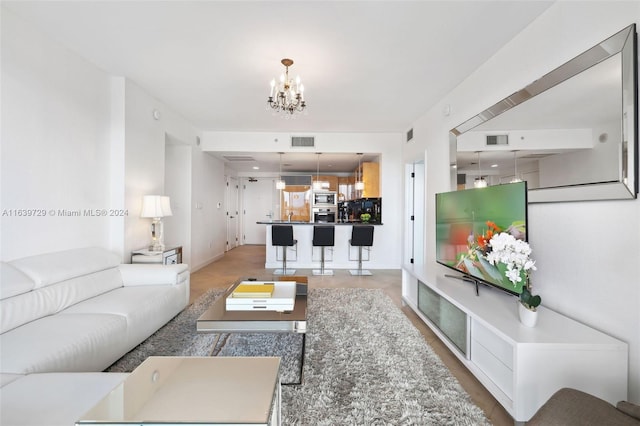 living room with an inviting chandelier