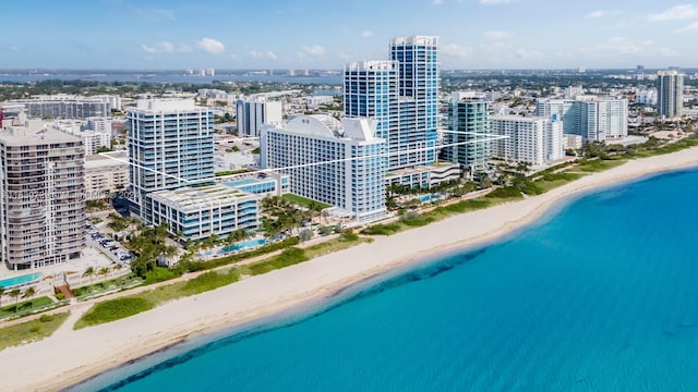 aerial view with a water view and a view of the beach