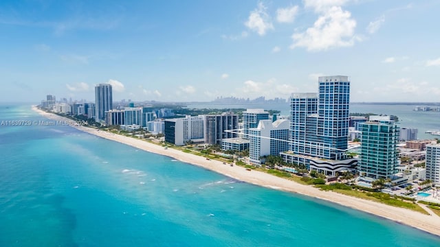 bird's eye view featuring a beach view and a water view