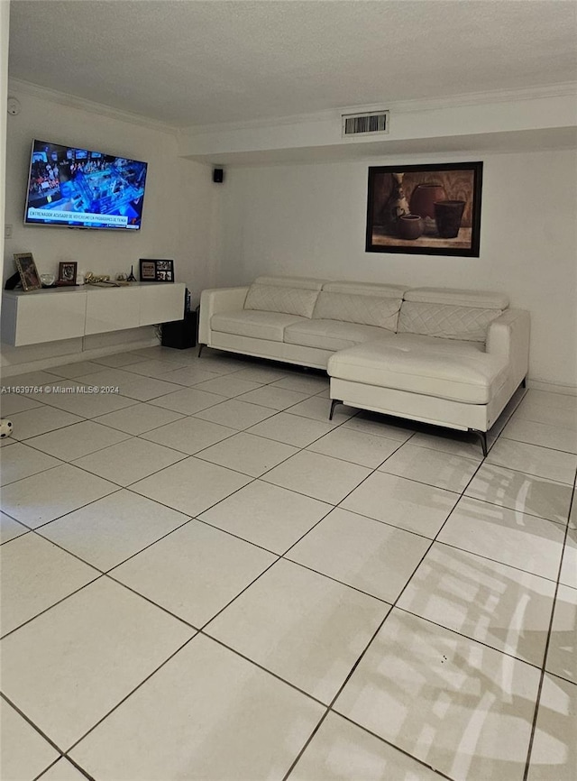 unfurnished living room with crown molding and light tile patterned floors