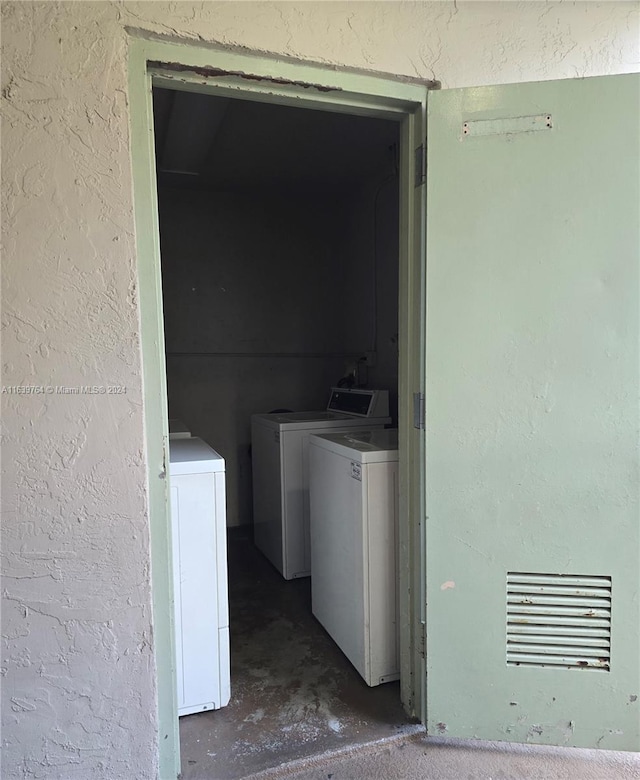 clothes washing area with independent washer and dryer