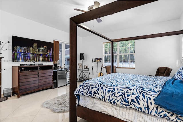 bedroom with ceiling fan and light tile patterned flooring