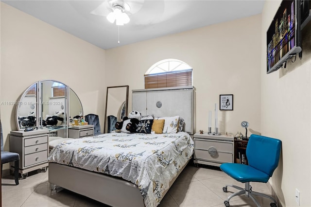 tiled bedroom with ceiling fan