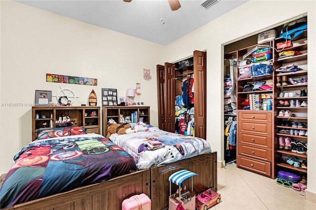 bedroom with ceiling fan and light tile patterned floors