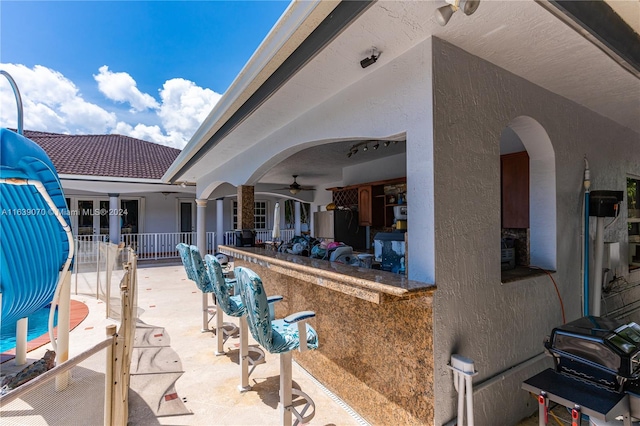 view of patio / terrace with ceiling fan