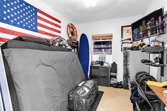 tiled bedroom with cooling unit and ceiling fan