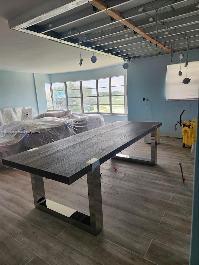 game room featuring dark wood-type flooring and a healthy amount of sunlight