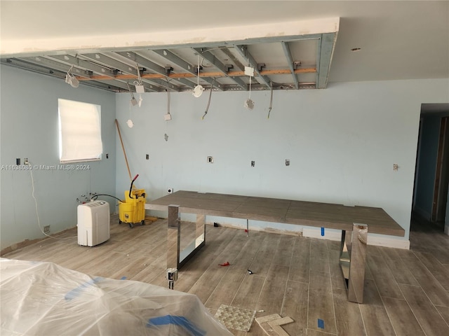 game room with hardwood / wood-style floors