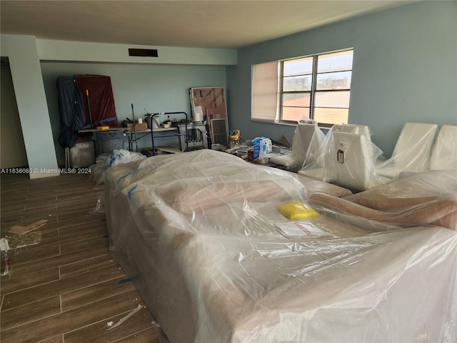 bedroom with hardwood / wood-style floors