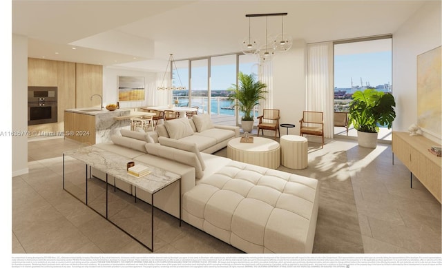 living area with expansive windows, a water view, and recessed lighting