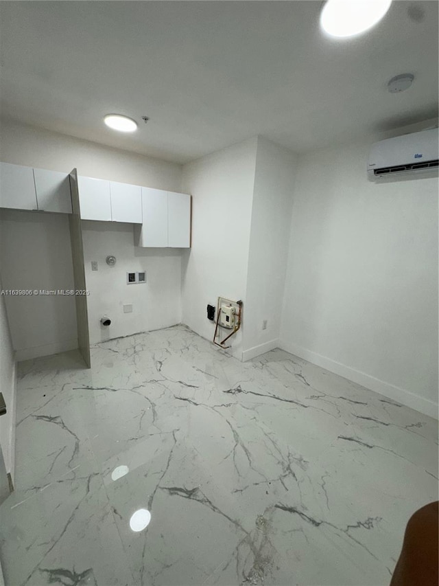 laundry room featuring an AC wall unit