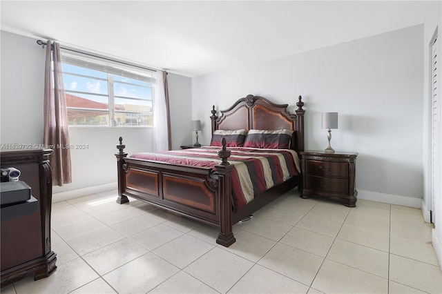 bedroom with light tile patterned floors