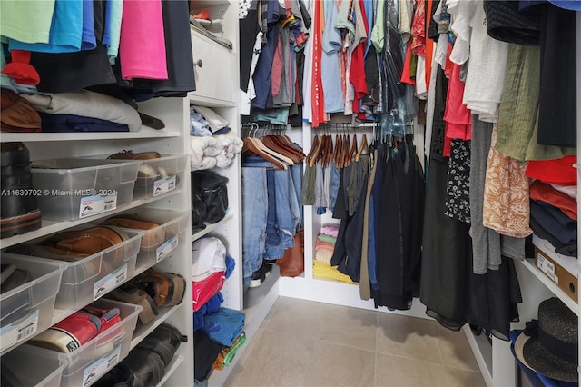 spacious closet with tile patterned floors