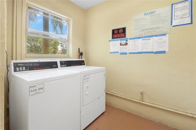 clothes washing area featuring washing machine and clothes dryer