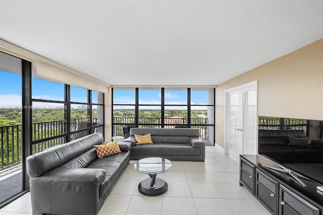 tiled living room with a wall of windows and a healthy amount of sunlight