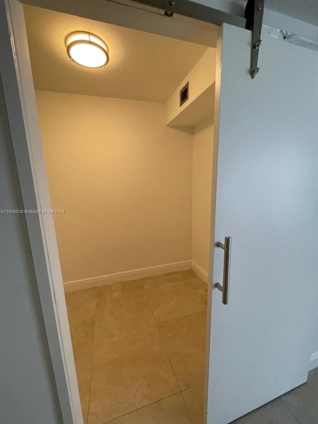 spacious closet featuring tile patterned flooring