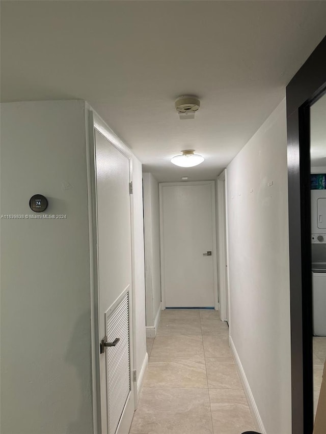 corridor featuring light tile patterned floors