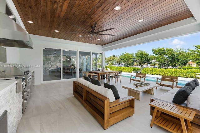 view of patio with ceiling fan, an outdoor kitchen, and outdoor lounge area