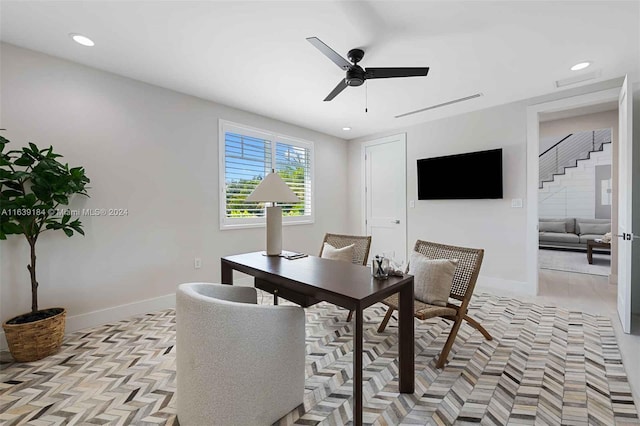 office area with ceiling fan and light parquet flooring