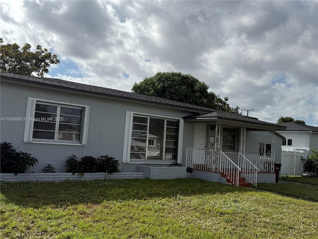 ranch-style home with a front yard