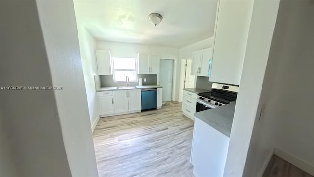 kitchen featuring white cabinets, stainless steel appliances, light hardwood / wood-style floors, and sink