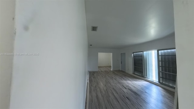 spare room featuring hardwood / wood-style flooring