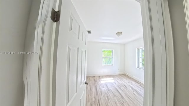 spare room featuring light hardwood / wood-style floors