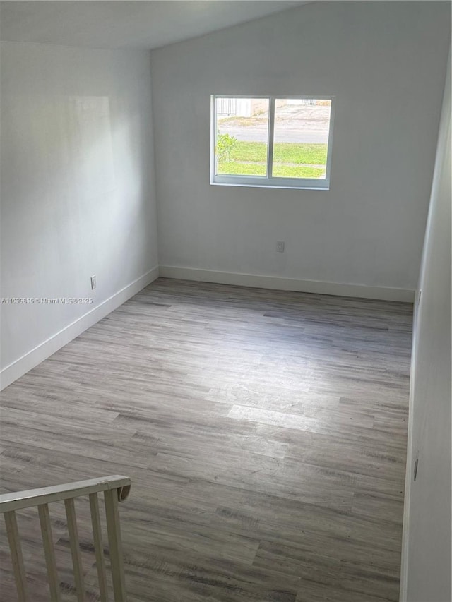 empty room featuring hardwood / wood-style floors