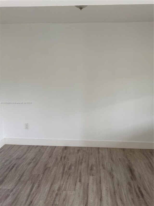 unfurnished room featuring light hardwood / wood-style floors