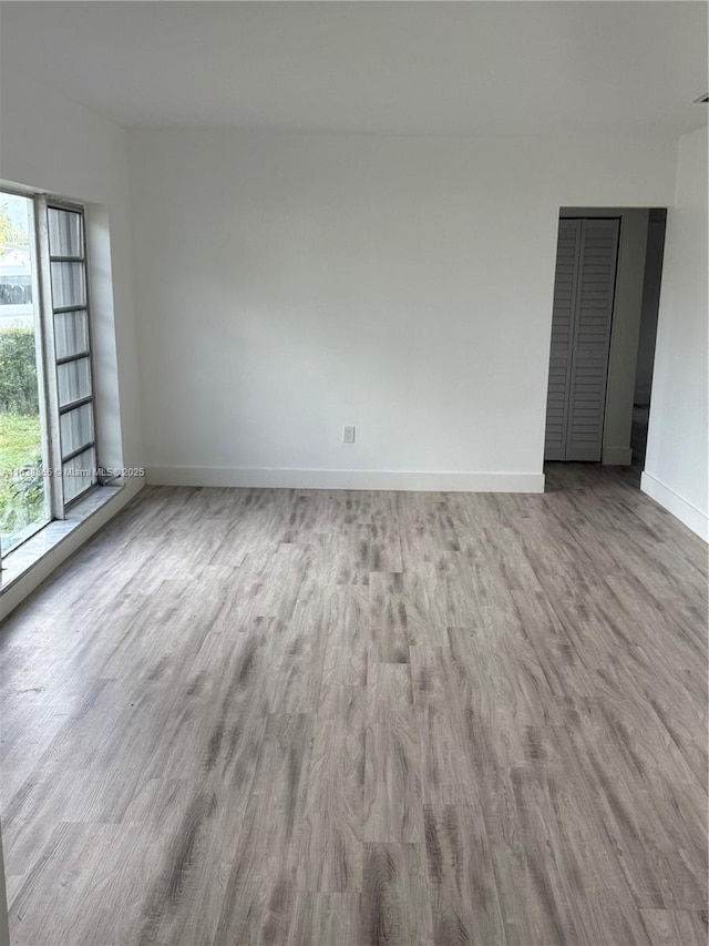 empty room with light wood-type flooring