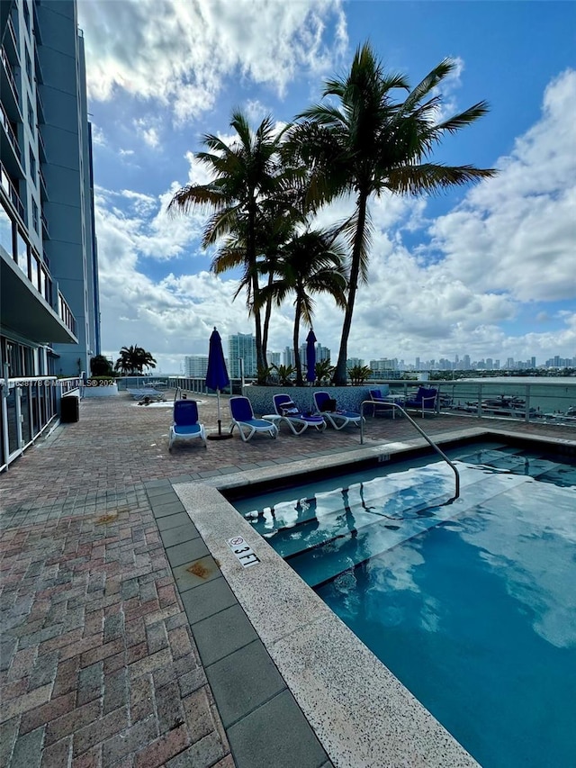 view of swimming pool featuring a patio area