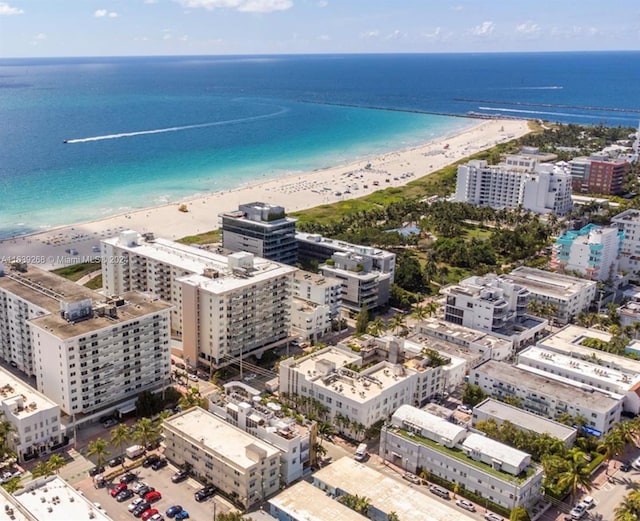 aerial view with a water view and a view of the beach