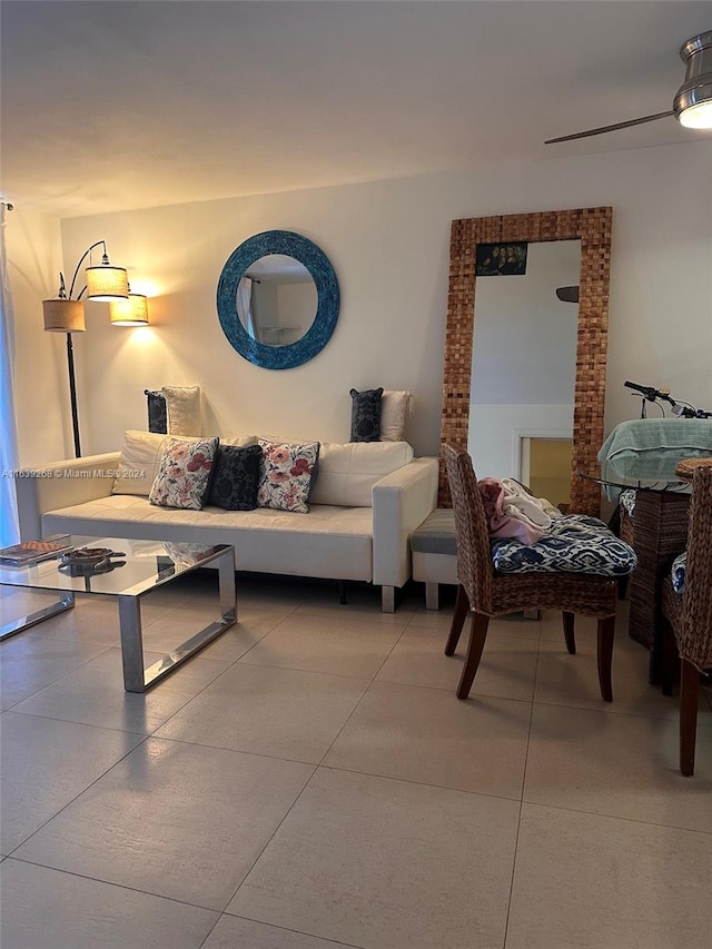 living room featuring brick wall and light tile patterned flooring