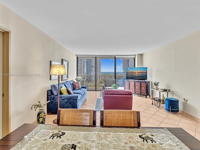 tiled living room with a wall of windows