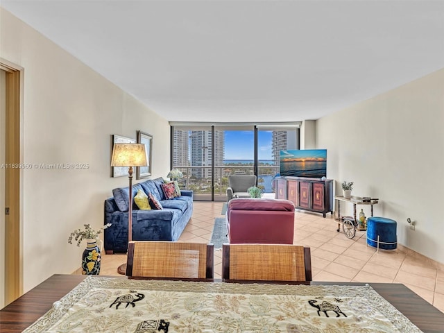 living room featuring tile patterned flooring and floor to ceiling windows