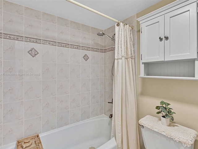 bathroom with shower / tub combo with curtain and toilet