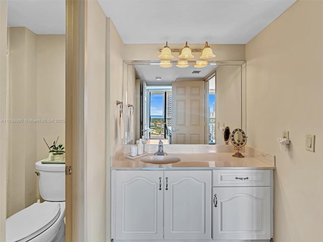 bathroom with vanity and toilet