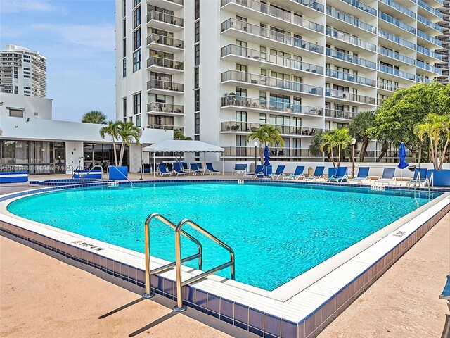 view of swimming pool featuring a patio