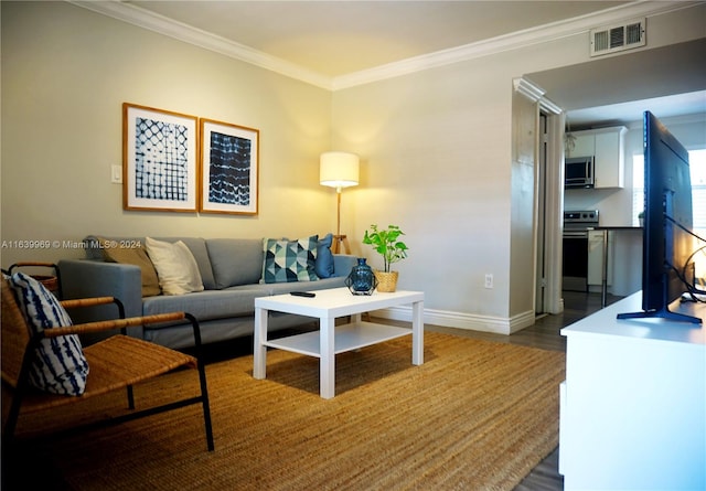 living room with ornamental molding and wood-type flooring