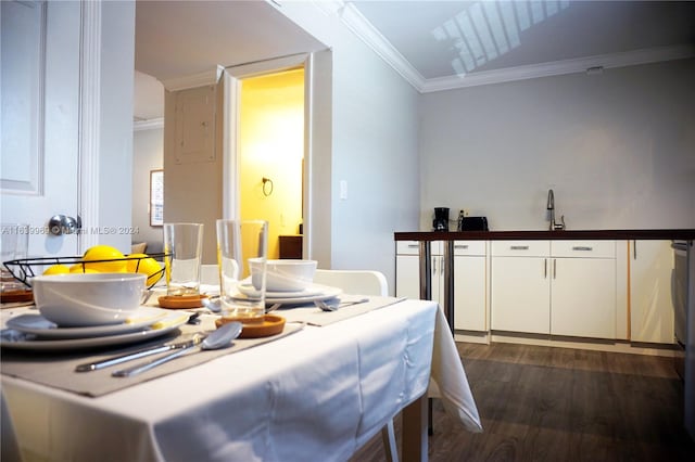 dining area featuring wood-type flooring and ornamental molding