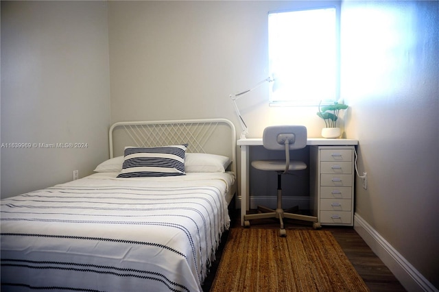 bedroom featuring dark wood-type flooring