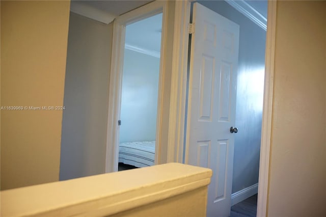 corridor featuring ornamental molding