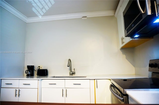 kitchen with sink, white cabinets, electric range, and crown molding