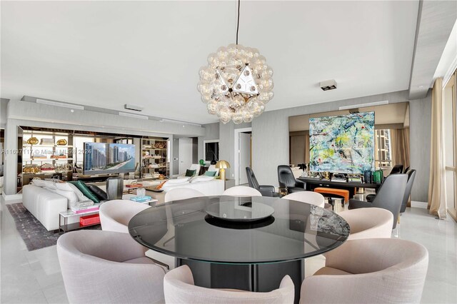 tiled dining area with a chandelier