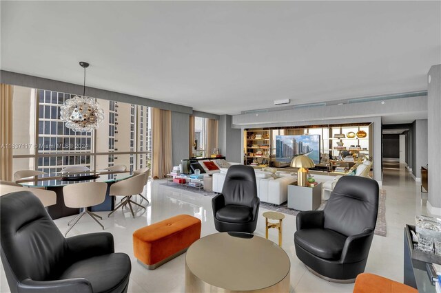 living room with floor to ceiling windows and an inviting chandelier